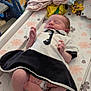 Poppy joined the competition — help win amazing prizes! newborn, baby, sleeping, infant, clothing, changing_mat, floral_pattern, baby_toys, baby_clothes, indoor, peaceful, cute, small, person, skin, foot, hand, bedroom, soft, resting