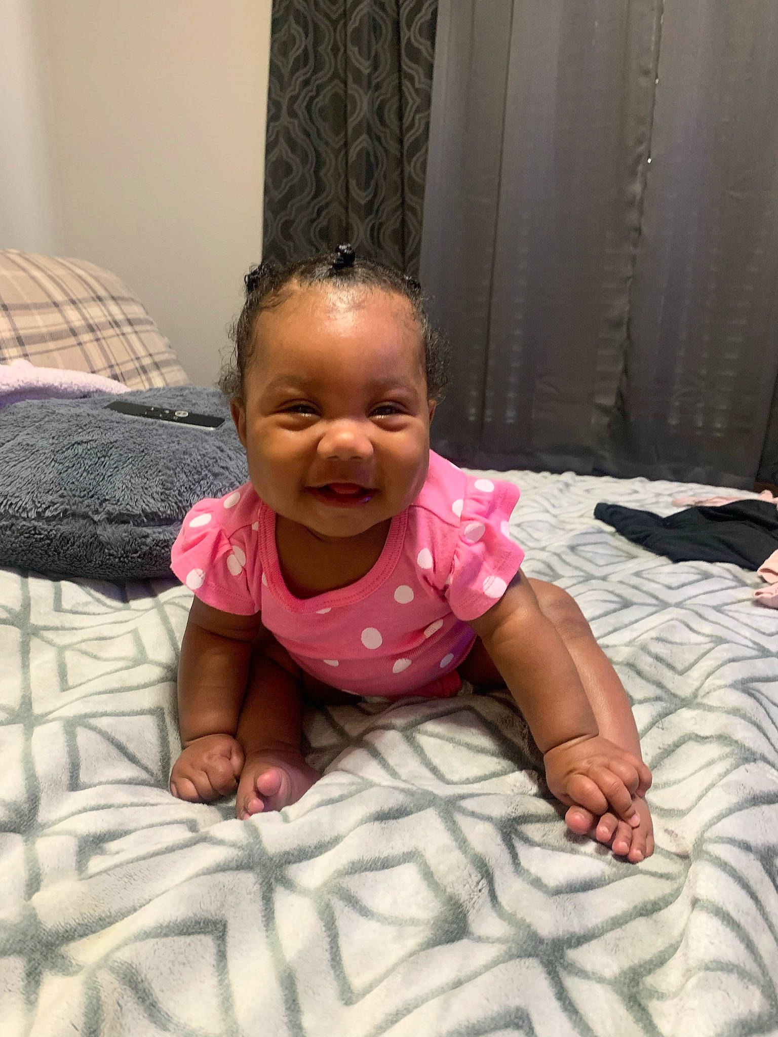 Kylee is registered to the contest to win money with this photo: baby, baby_toddler_clothing, cheek, comfort, crawling, eye, face, floor, flooring, hairstyle, happy, head, mouth, nose, person, pink, skin, sleeve, smile, standing