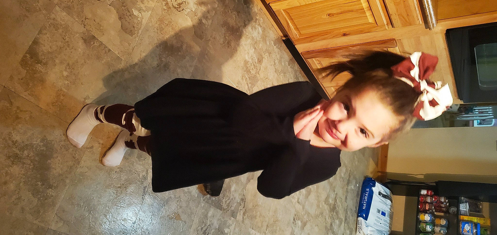 Ellena is registered to the contest to win money with this photo: child, elbow, eyewear, flash_photography, flooring, formal_wear, fun, gesture, happy, hardwood, joy, person, room, shoulder, sitting, smile, suit, toddler, wood, wrist