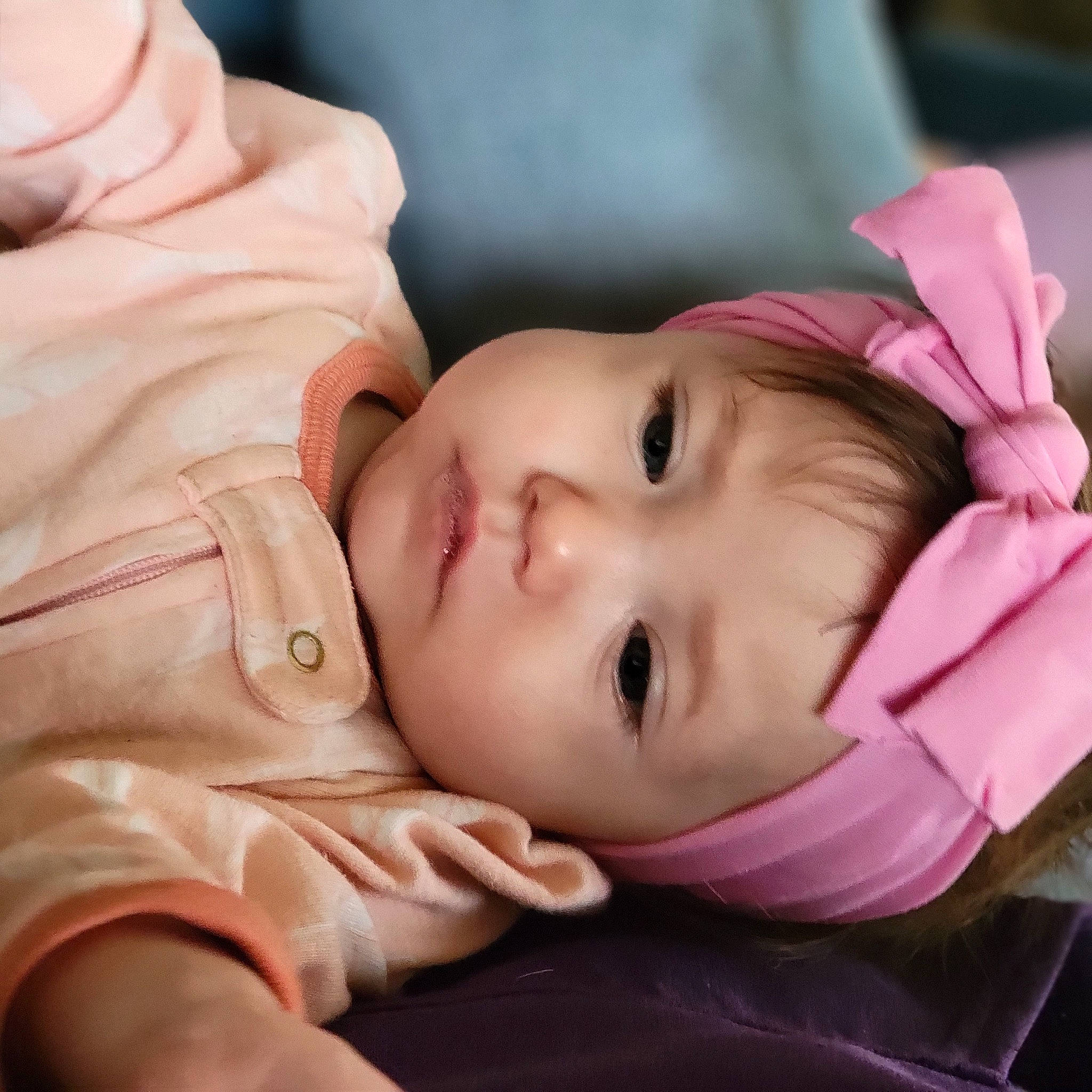 Lyvie Jo is registered to the contest to win money with this photo: baby, cheek, chin, comfort, eye, eyebrow, eyelash, face, gesture, hand, head, headgear, headwear, iris, lip, mammal, mouth, neck, nose, person