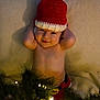 baby, child, smiling, hat, crochet, blanket, christmas_lights, holiday, festive, greenery, infant, cute, portrait, laying_down, indoors, warm, happy, toddler, skin, hands