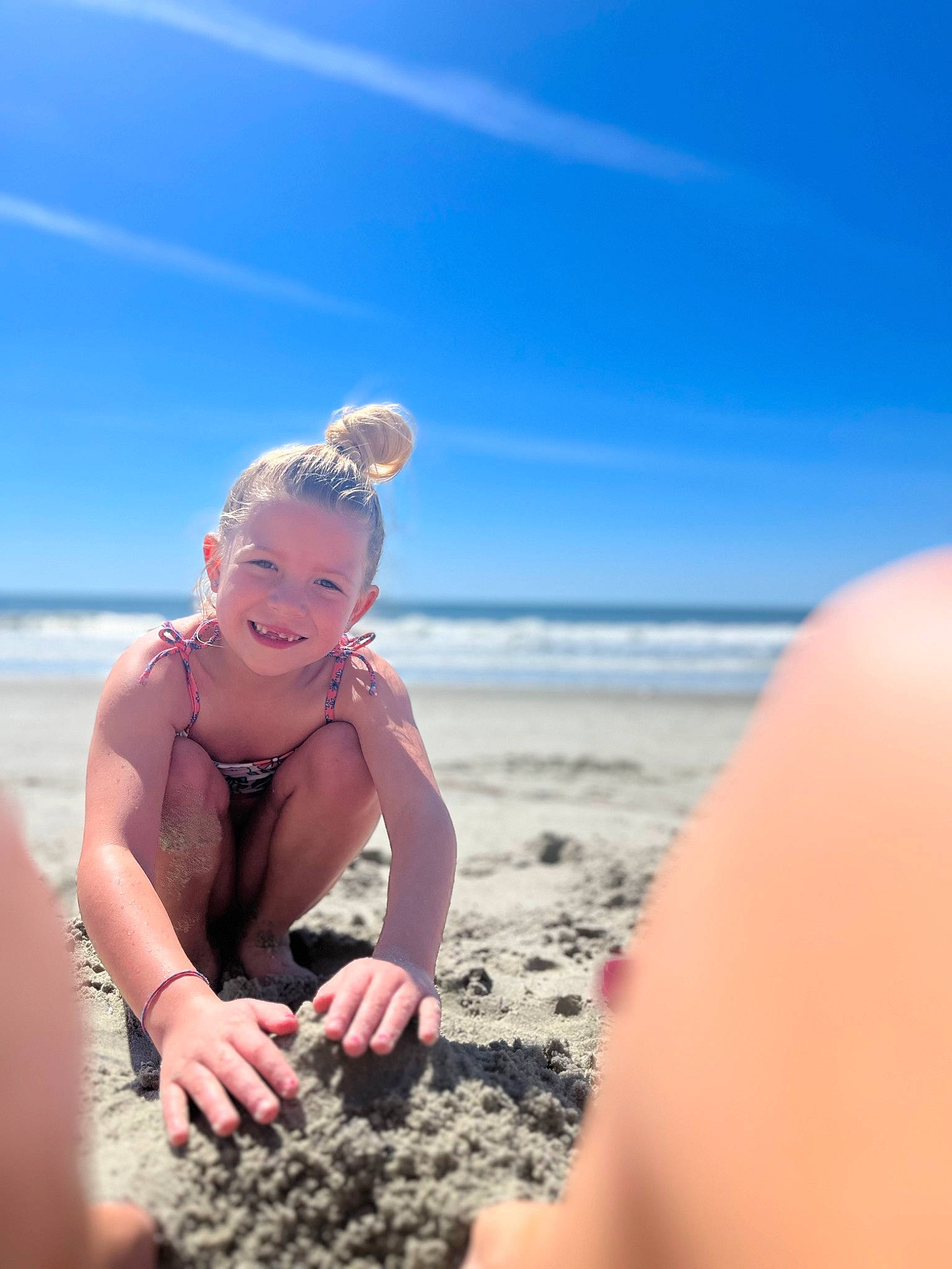 Arianna joined the competition — help win amazing prizes! beach, cloud, coast, coastal_and_oceanic_landforms, flash_photography, fun, gesture, happy, holiday, horizon, joy, landscape, leisure, people_in_nature, people_on_beach, person, shore, sky, smile, toddler