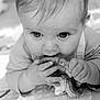 baby, infant, teething_toy, hands, face, close_up, black_and_white, cute, child, mouth, expression, skin, eyes, young, play, crawling, soft_light, indoors, portrait, adorable