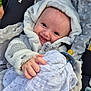 Sandro participe au concours pour gagner de l'argent avec cette photo : baby, blanket, bonnet, clothing, coat, face, happy, hat, head, hood, hoodie, jacket, knitwear, newborn, person, photography, portrait, smile, sweater, sweatshirt
