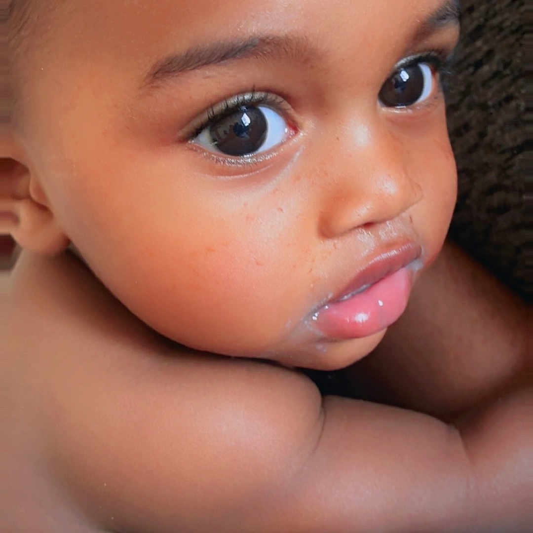 Jaymari is registered to the contest to win money with this photo: baby, child, close_up, colorful, curious, cute, expression, eyes, face, head, indoors, infant, pattern, person, portrait, pouty_lips, resting, skin, soft_lighting, young