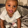 Jaymari is registered to the contest to win money with this photo: baby, blanket, child, clothing, comfort, crawling, cute, expression, eyes, face, hand, happy, indoors, infant, mouth, person, skin, smiling, soft, toddler