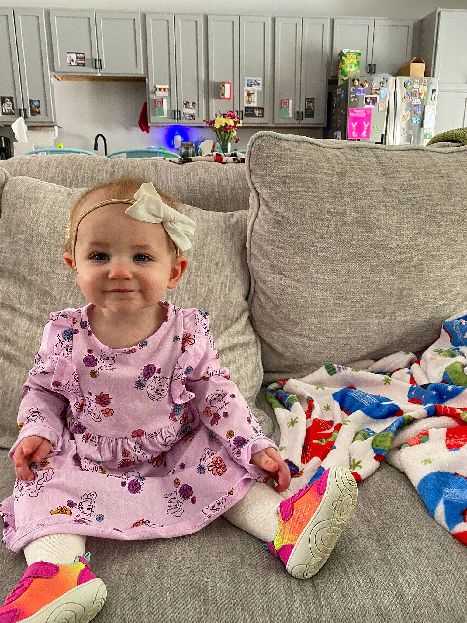 Lindi joined the competition — help win amazing prizes! baby, baby_toddler_clothing, child, comfort, couch, flooring, fun, happy, headwear, houseplant, interior_design, joy, linens, living_room, pattern, person, play, purple, room, sitting