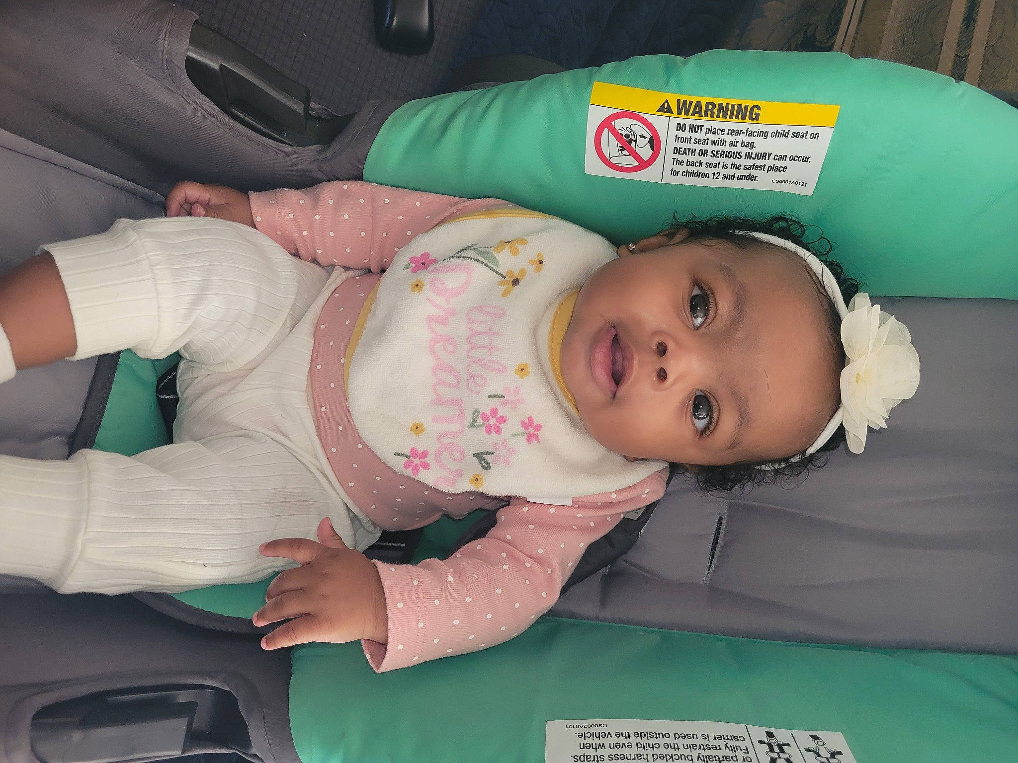 Skyla is registered to the contest to win money with this photo: baby, baby_products, baby_safety, baby_toddler_clothing, car_seat, cheek, child, comfort, green, person, room, skin, toddler, vehicle_door