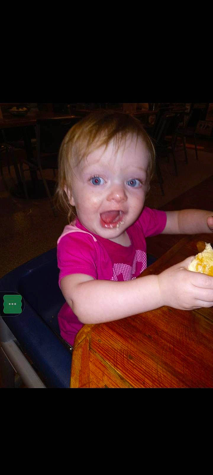 Evangelina is registered to the contest to win money with this photo: baby, baby_toddler_clothing, cheek, child, comfort_food, finger, food, food_craving, fun, hand, iris, person, play, sitting, skin, smile, table, tableware, thumb, toddler