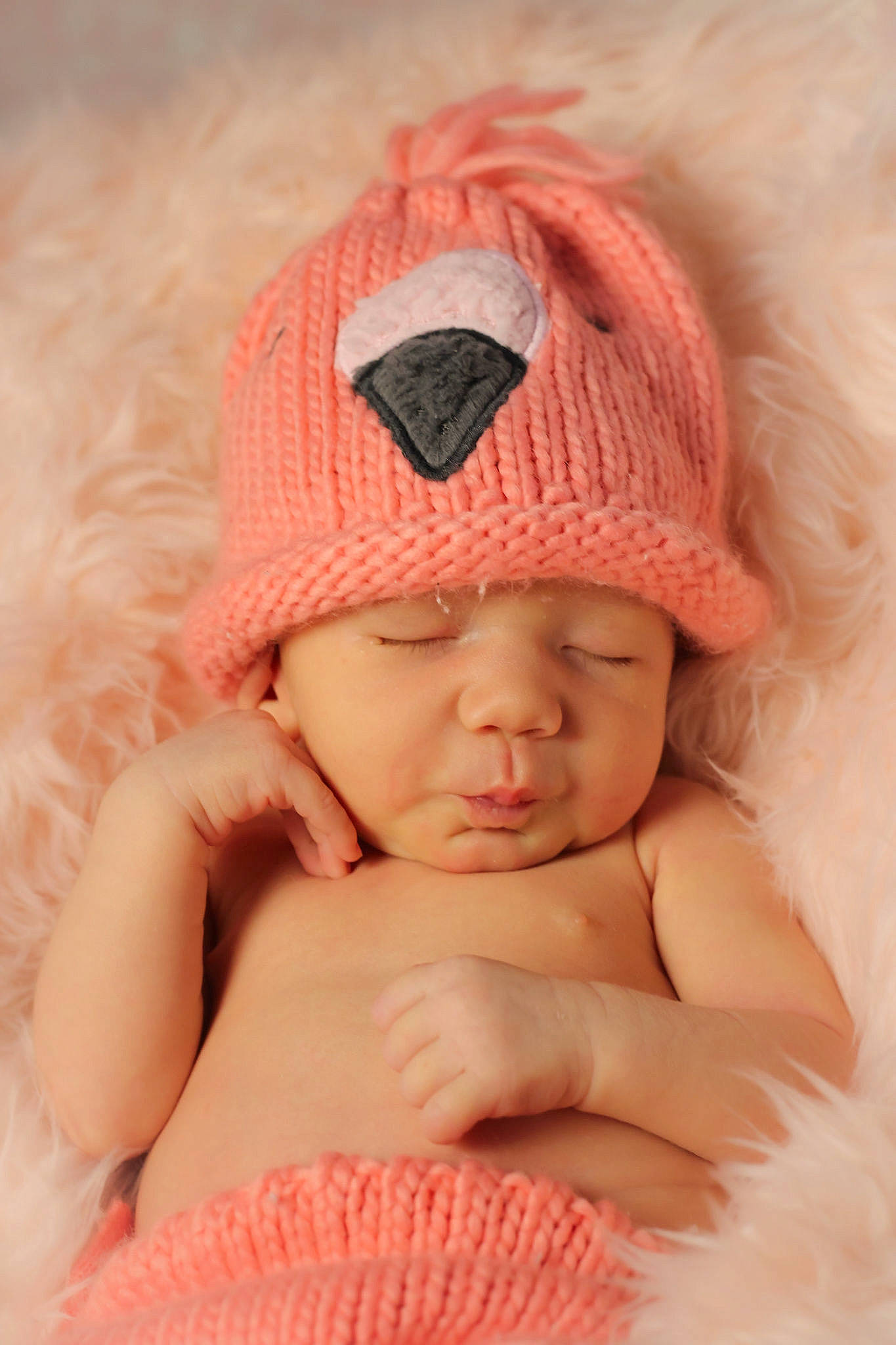 Melena is registered to the contest to win money with this photo: baby, baby_sleeping, baby_toddler_clothing, beauty, cap, comfort, eye, face, finger, hand, headgear, headwear, knit_cap, lip, mouth, orange, person, pink, skin, textile