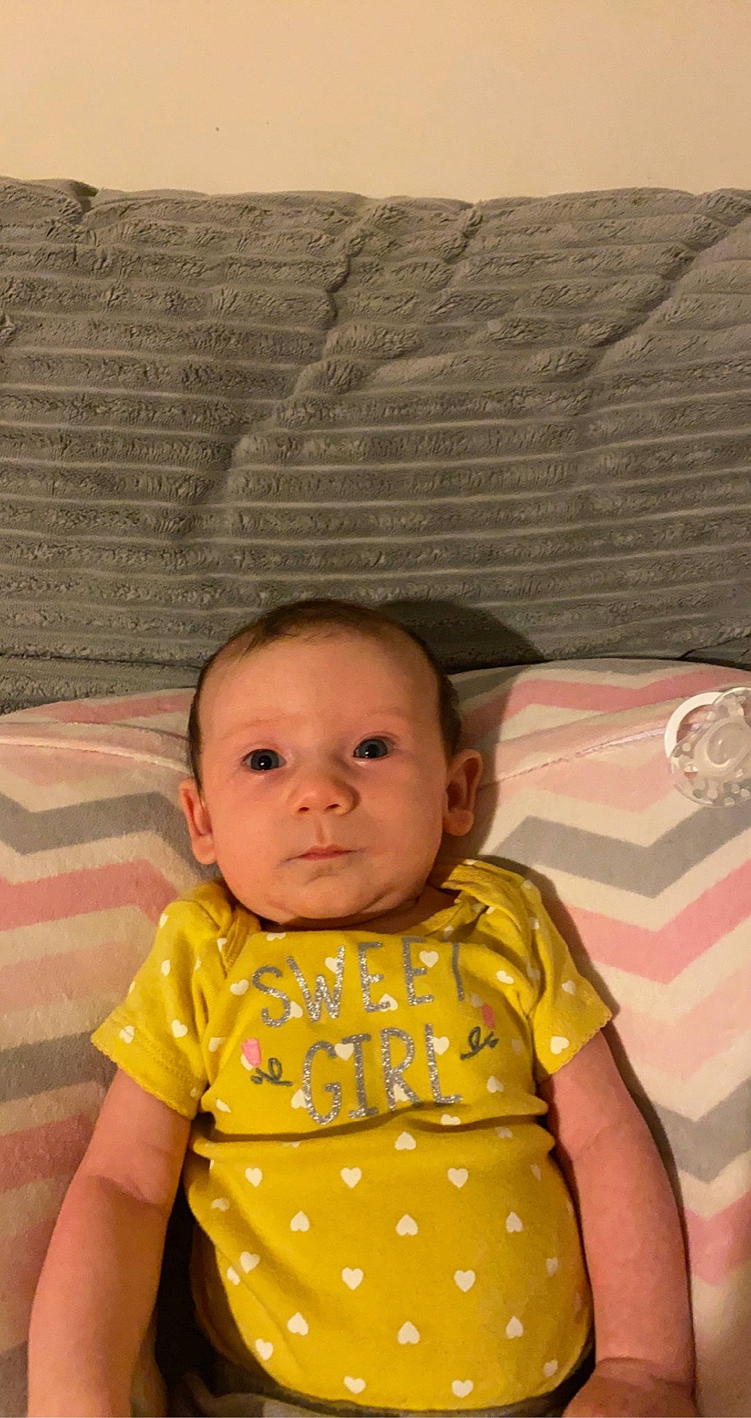 Melena is registered to the contest to win money with this photo: baby, baby_toddler_clothing, cheek, child, chin, comfort, face, happy, head, iris, linens, nose, one_piece_garment, pattern, person, pink, skin, sleeve, textile, toddler