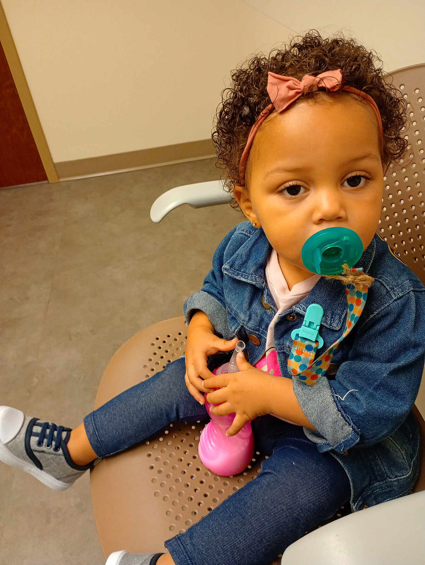 Hayzel joined the competition — help win amazing prizes! accessories, baby, bodypart, clothing, coat, couch, face, finger, footwear, furniture, hand, head, jeans, pants, person, photography, portrait, shoe, sitting, sneaker