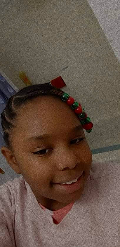 Makylla is registered to the contest to win money with this photo: black_hair, cheek, child, chin, eyebrow, eyelash, face, fashion_accessory, forehead, fun, happy, joy, lip, lipstick, mouth, nose, person, plant, skin, smile