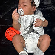 Javion joined the competition — help win amazing prizes! baby, infant, pacifier, cap, onesie, basketball, sleeping, child, clothing, footwear, socks, hand, face, skin, headwear, toy, relaxation, sleep, indoor, portrait