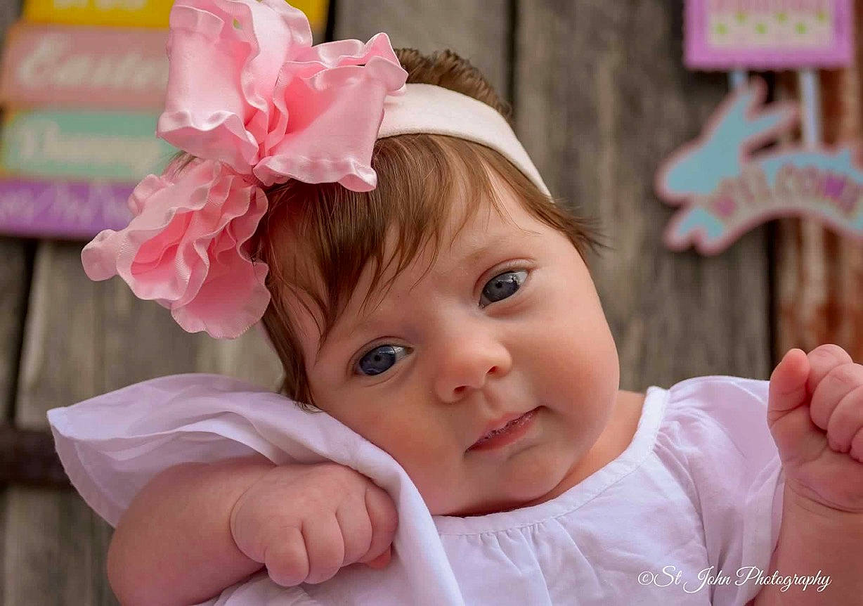 Jayleigh is registered to the contest to win money with this photo: baby, brown_hair, cheek, child, fashion_accessory, hair_accessory, headband, headgear, headpiece, person, pink, smile, toddler