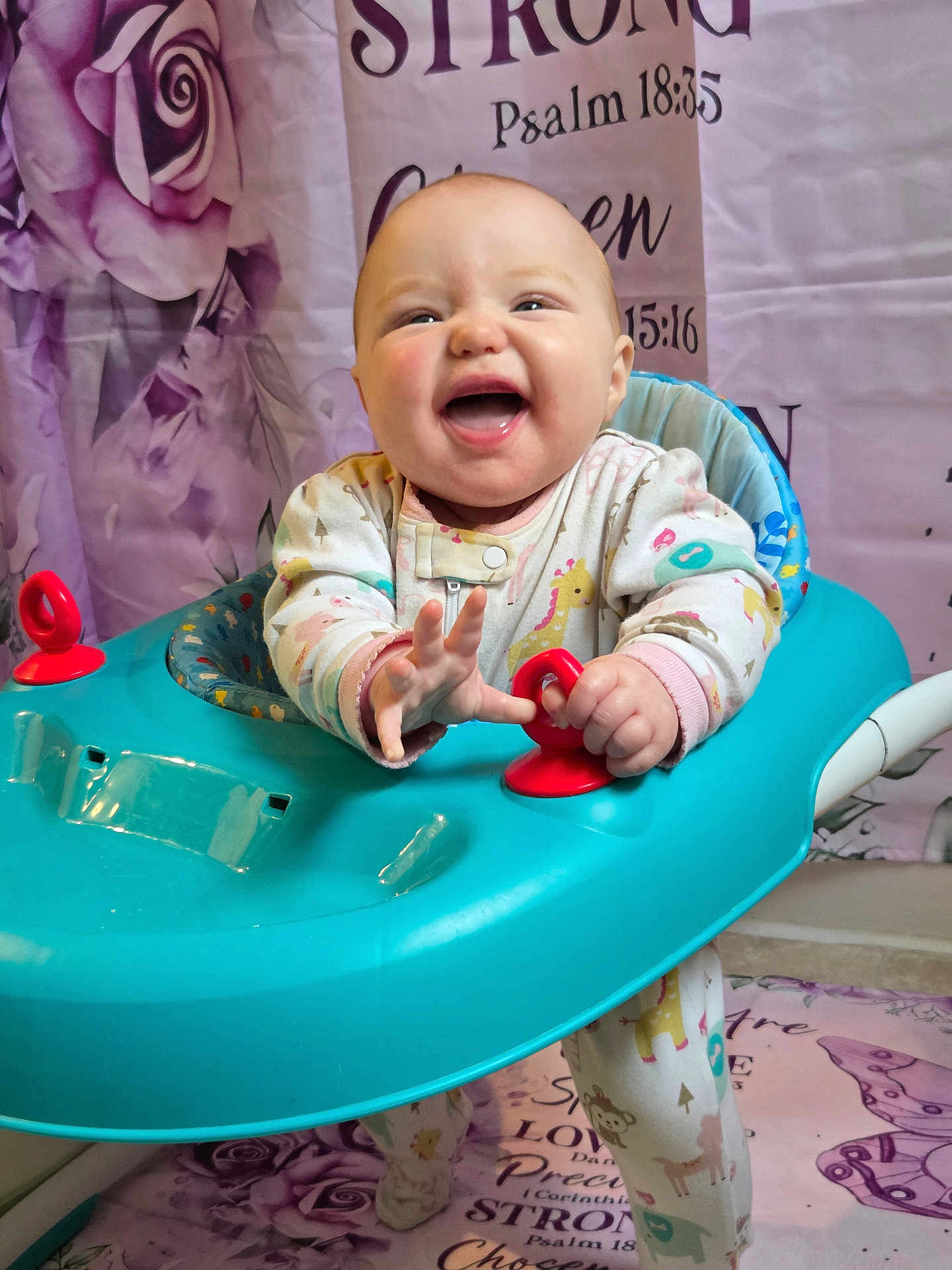 Grace joined the competition — help win amazing prizes! baby, smiling, walker, onesie, indoor, happy, child, face, hands, toy, background, purple, roses, text, floor, playtime, cute, infant, person, colorful