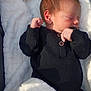 Jaxson joined the competition — help win amazing prizes! newborn, baby, sleeping, black_clothing, blanket, cozy, infant, peaceful, cute, resting, fist, soft, portrait, child, young, indoors, warm, comfort, small, head