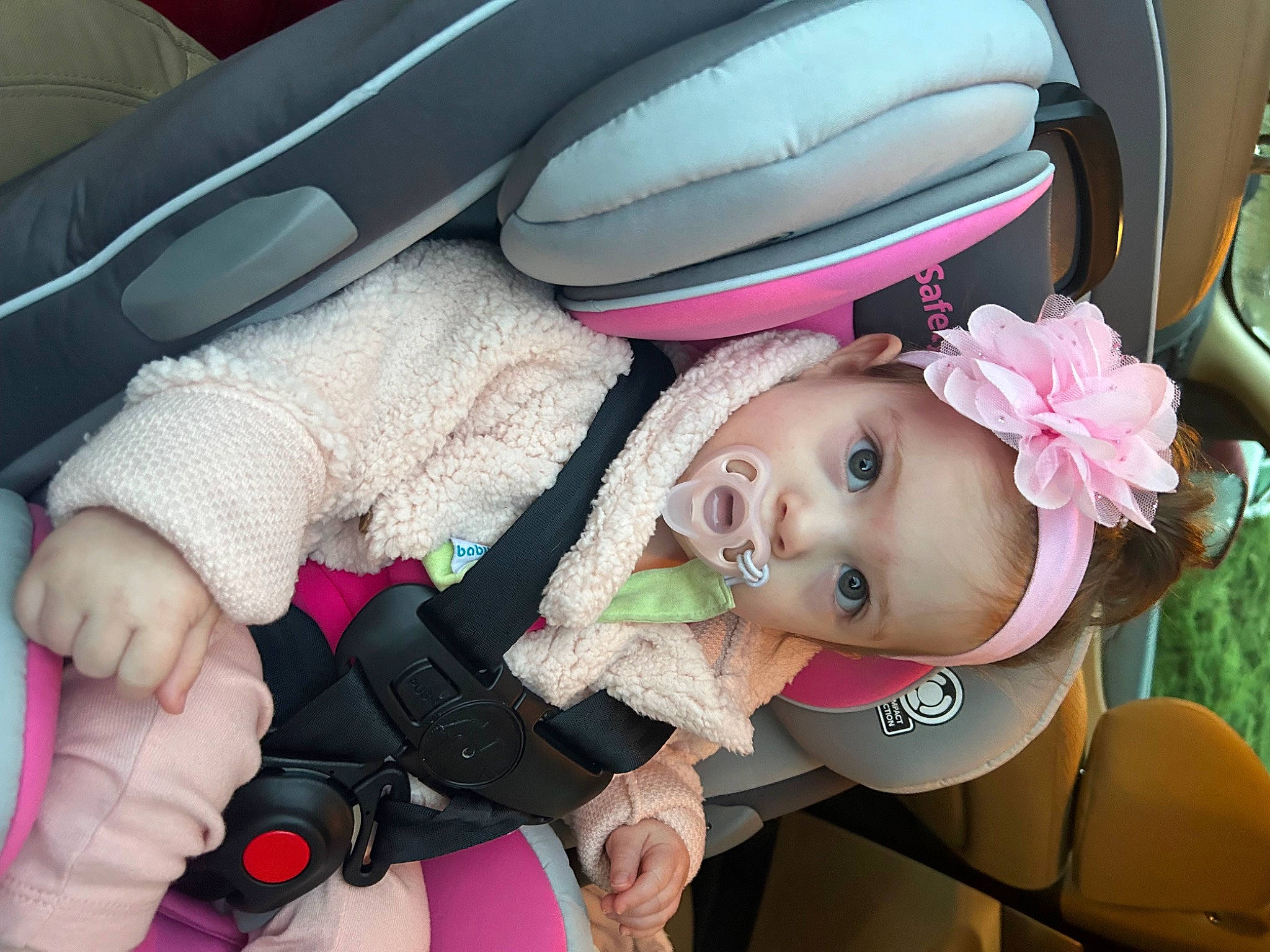 Delaney is registered to the contest to win money with this photo: auto_part, baby, baby_carriage, baby_products, baby_toddler_clothing, car, car_seat, cheek, child, comfort, family_car, fashion_accessory, happy, hat, headwear, luxury_vehicle, person, pink, steering_wheel, toddler