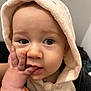Eden a rejoint le concours — aidez-le/la à gagner de superbes lots ! baby, child, face, hand, hood, clothing, cute, portrait, expression, skin, eyelashes, fingers, zipper, indoor, person, closeup, curious, soft, warm, young