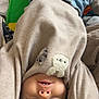 baby, child, upside_down, smiling, sweater, blue_jeans, face, teeth, playmat, colorful, toy, indoor, cute, patches, infant, happy, person, clothing, soft, skin