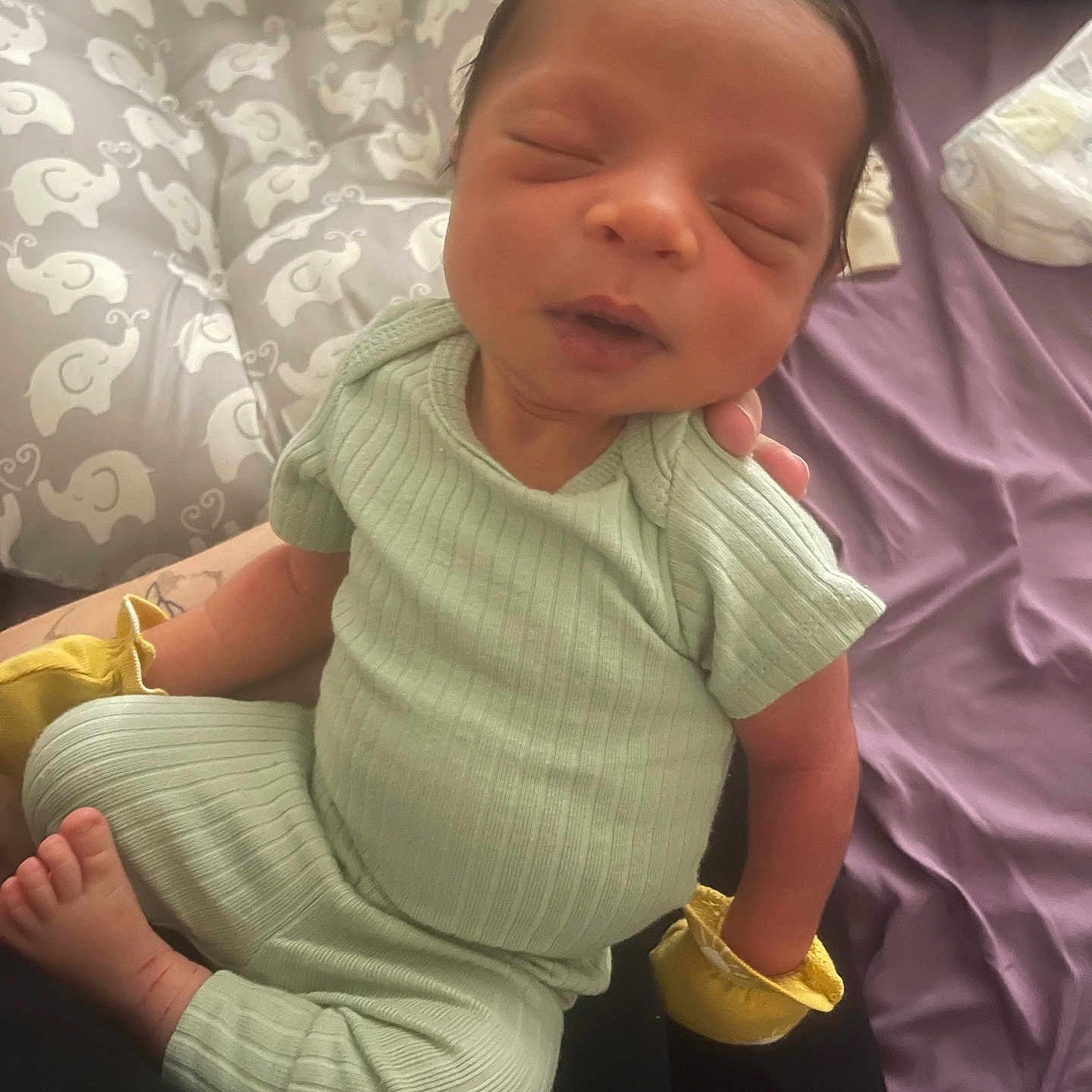 Treshaun is registered to the contest to win money with this photo: baby, child, clothing, cozy, cushion, cute, elephant_pattern, feet, hands, indoor, infant, mittens, newborn, peaceful, person, portrait, resting, sleeping, small, soft