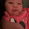 arm, baby, baby_garment, cartoon_character, child, close_up, curious, cute, expression, eyes, face, hair, hand, indoor, infant, person, pink_clothing, portrait, skin, young