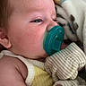 baby, blanket, child, close_up, comfort, cozy, cute, face, indoors, infant, mittens, newborn, pacifier, portrait, resting, skin, sleepy, soft, striped, yellow_clothing