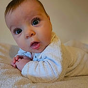 Sofia participe au concours pour gagner de l'argent avec cette photo : baby, infant, child, face, eyes, hands, white_clothing, blanket, soft_texture, curious, lying_down, indoors, closeup, cute, skin, portrait, newborn, expression, head, baby_girl