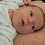 Sofia participe au concours pour gagner de l'argent avec cette photo : baby, infant, face, eyes, mouth, hand, clothing, soft_surface, closeup, expression, newborn, skin, sleepwear, lying_down, cute, indoor, child, person, portrait, cozy
