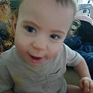Caleb joined the competition — help win amazing prizes! toddler, child, baby, indoor, close_up, curious_expression, light_shirt, stains, pillow, blanket, hair, face, person, infant, candid, seated, furniture, home, young_child, cute