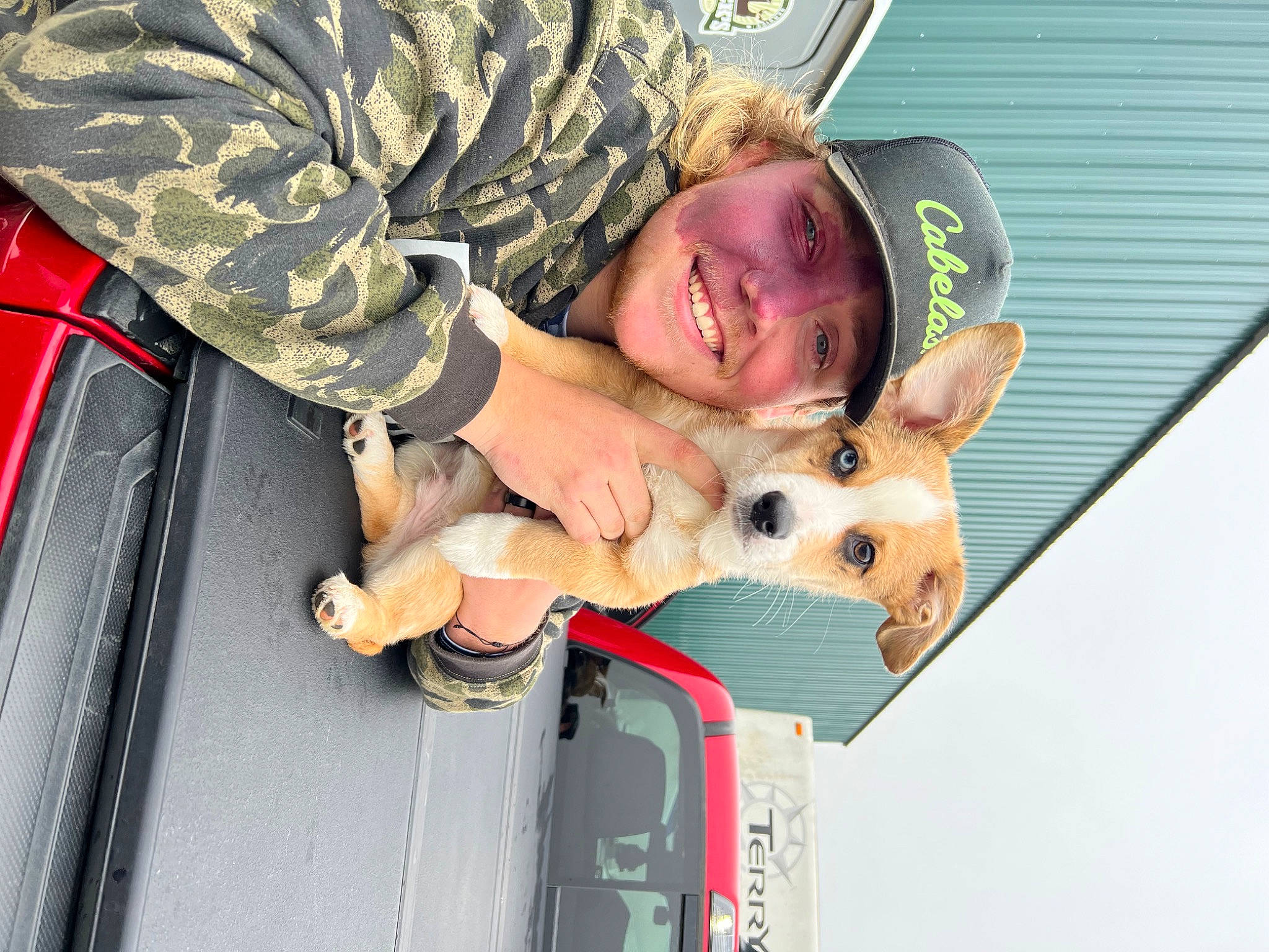 August is registered to the contest to win money with this photo: boot, camouflage, carnivore, companion_dog, dog, dog_breed, eyewear, fawn, fun, fur, happy, leisure, military_camouflage, military_person, military_uniform, recreation, smile, soldier, sunglasses, vertebrate