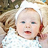Ryleigh is registered to the contest to win money with this photo: baby, beige, blue_eyes, child, closeup, cute, fabric, face, floral_clothing, hand, happy, headband, infant, newborn, outdoor, person, portrait, smiling, soft_texture, white