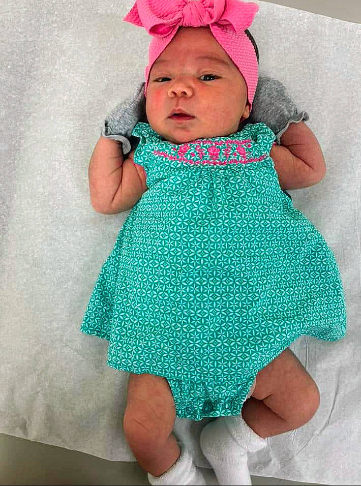 Journee joined the competition — help win amazing prizes! aqua, azure, baby, baby_toddler_clothing, cap, dress, eye, face, finger, hand, head, headgear, headwear, outerwear, person, pink, product, purple, skin, sleeve