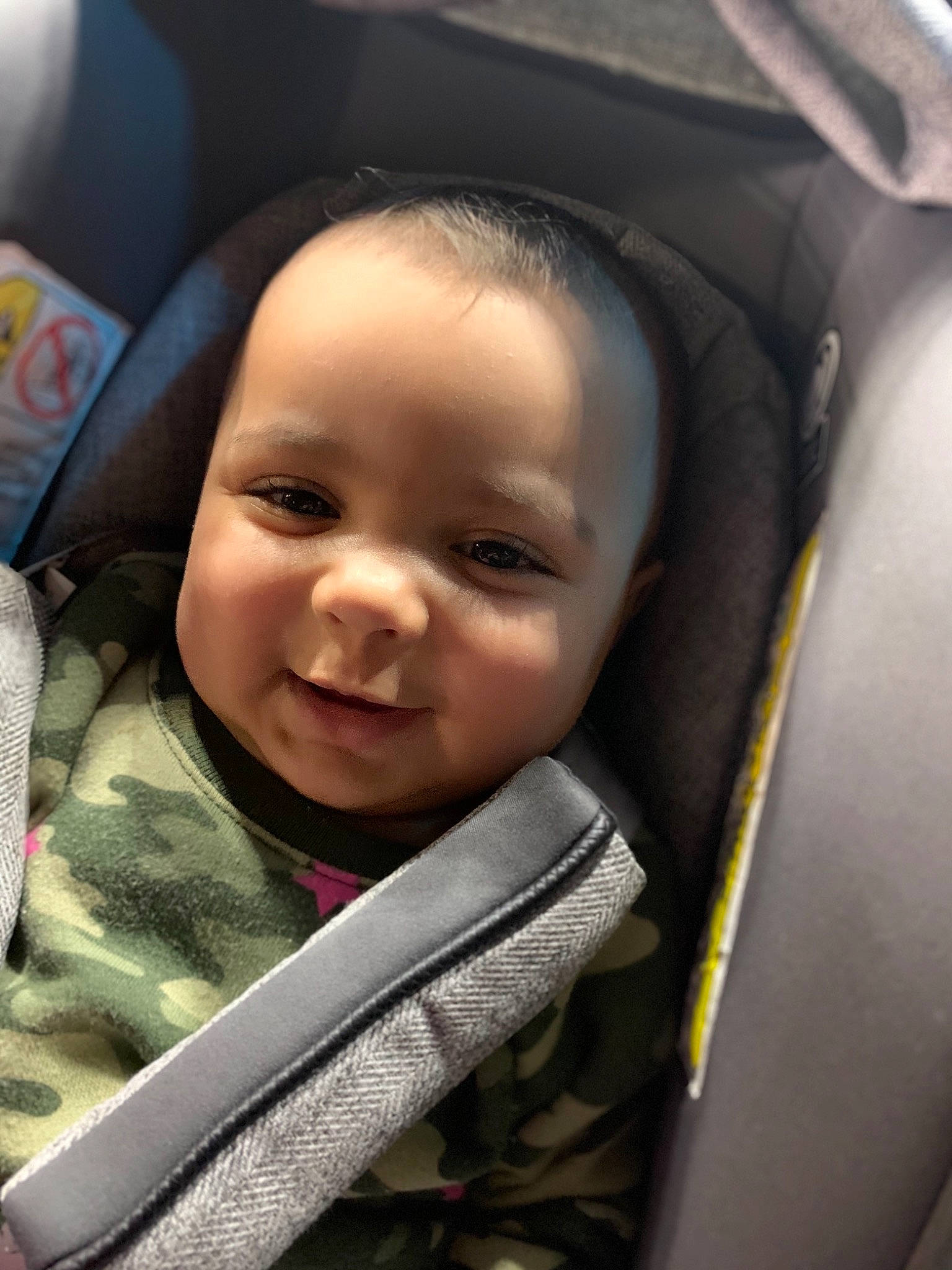 Nizhoni is registered to the contest to win money with this photo: auto_part, baby, baby_carriage, baby_products, baby_toddler_clothing, car_seat, cheek, child, comfort, eyebrow, face, facial_expression, fun, happy, head, head_restraint, person, product, seat_belt, smile