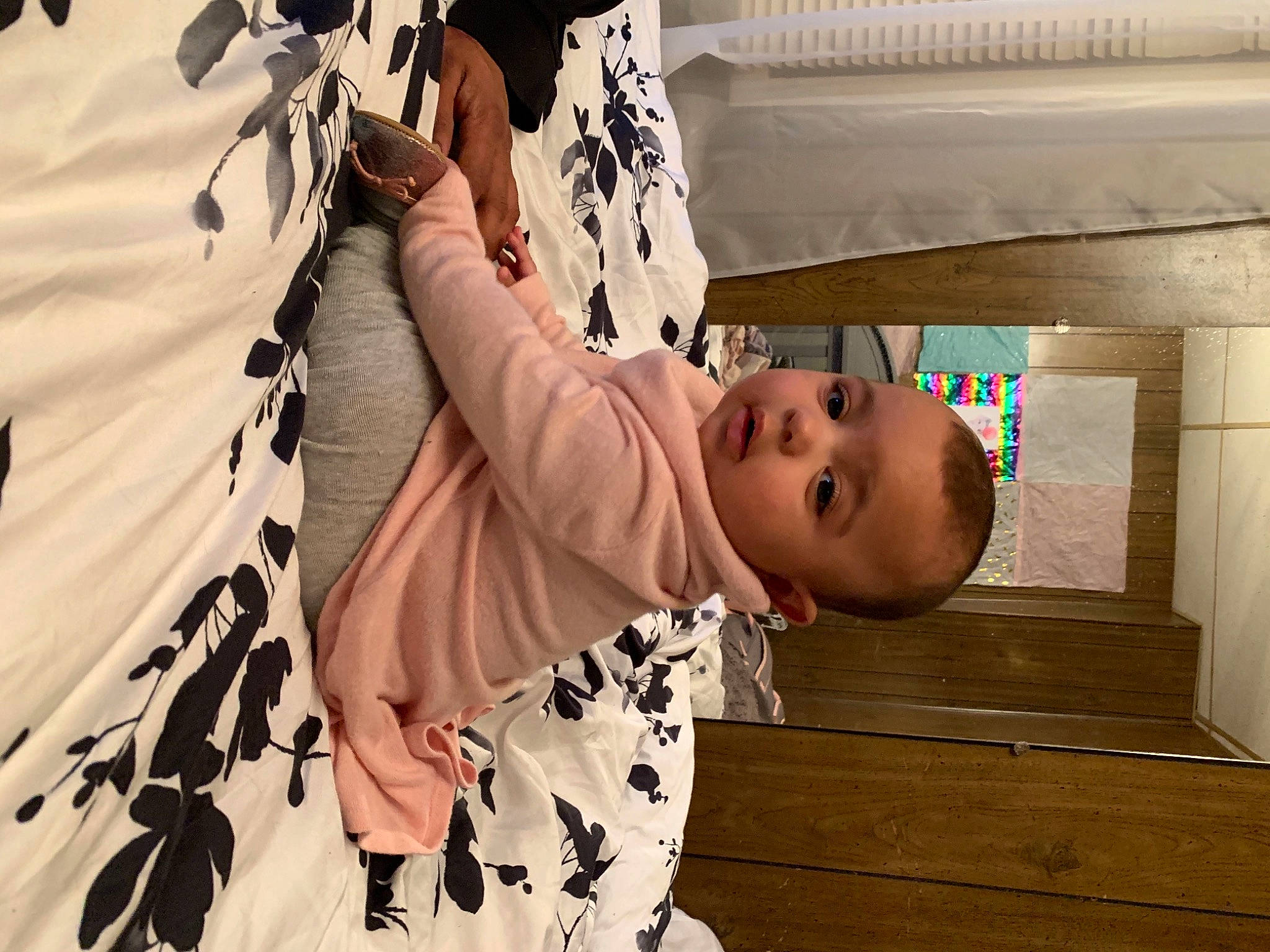 Nizhoni is registered to the contest to win money with this photo: arm, baby, baby_toddler_clothing, eye, facial_expression, finger, gesture, hairstyle, happy, head, human, mammal, pattern, person, plant, product, sleeve, t_shirt, textile, toddler