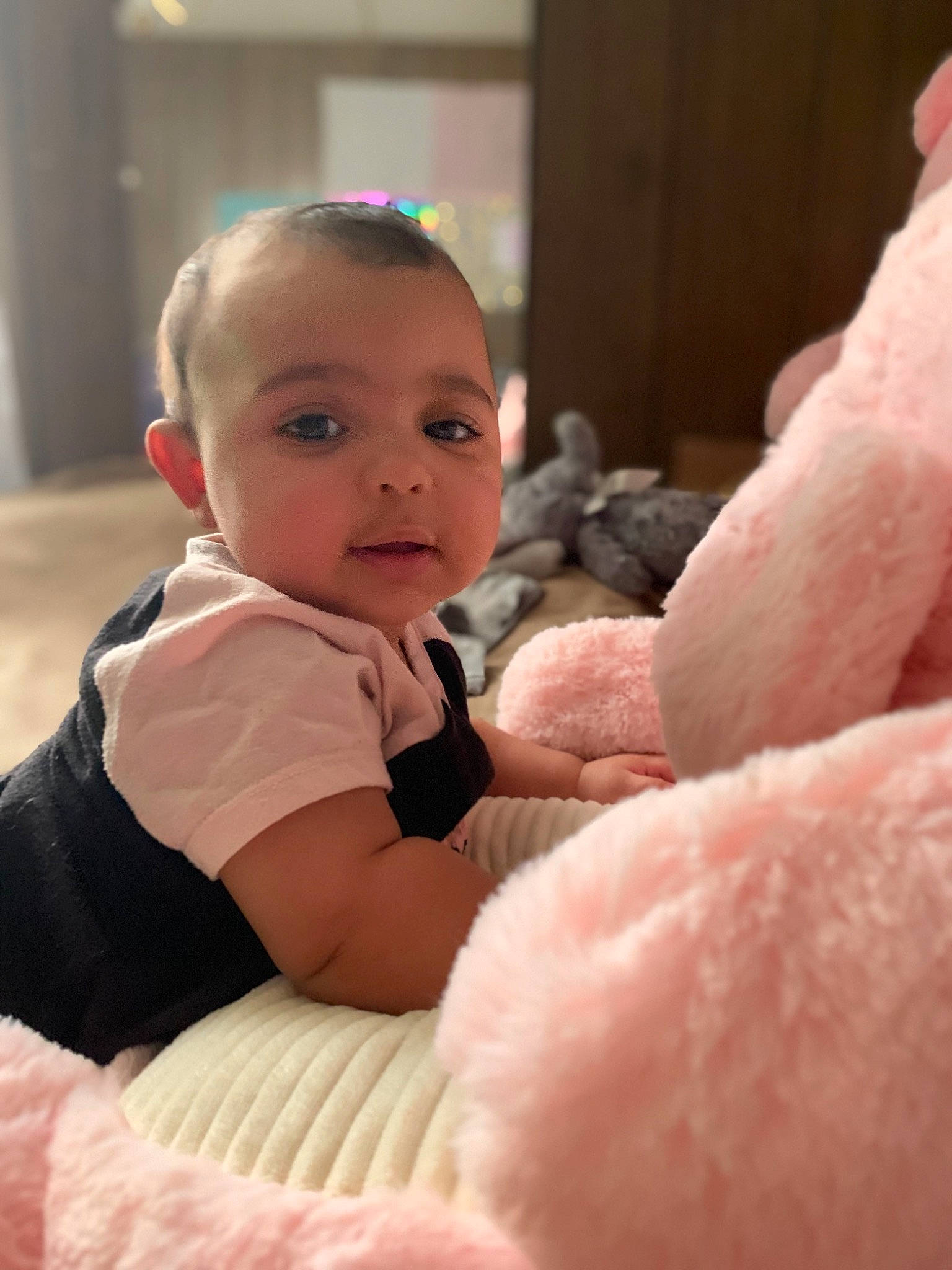 Nizhoni joined the competition — help win amazing prizes! baby, baby_toddler_clothing, cheek, child, chin, comfort, eye, flash_photography, flooring, fun, gesture, happy, head, iris, mammal, person, pink, sitting, skin, thumb