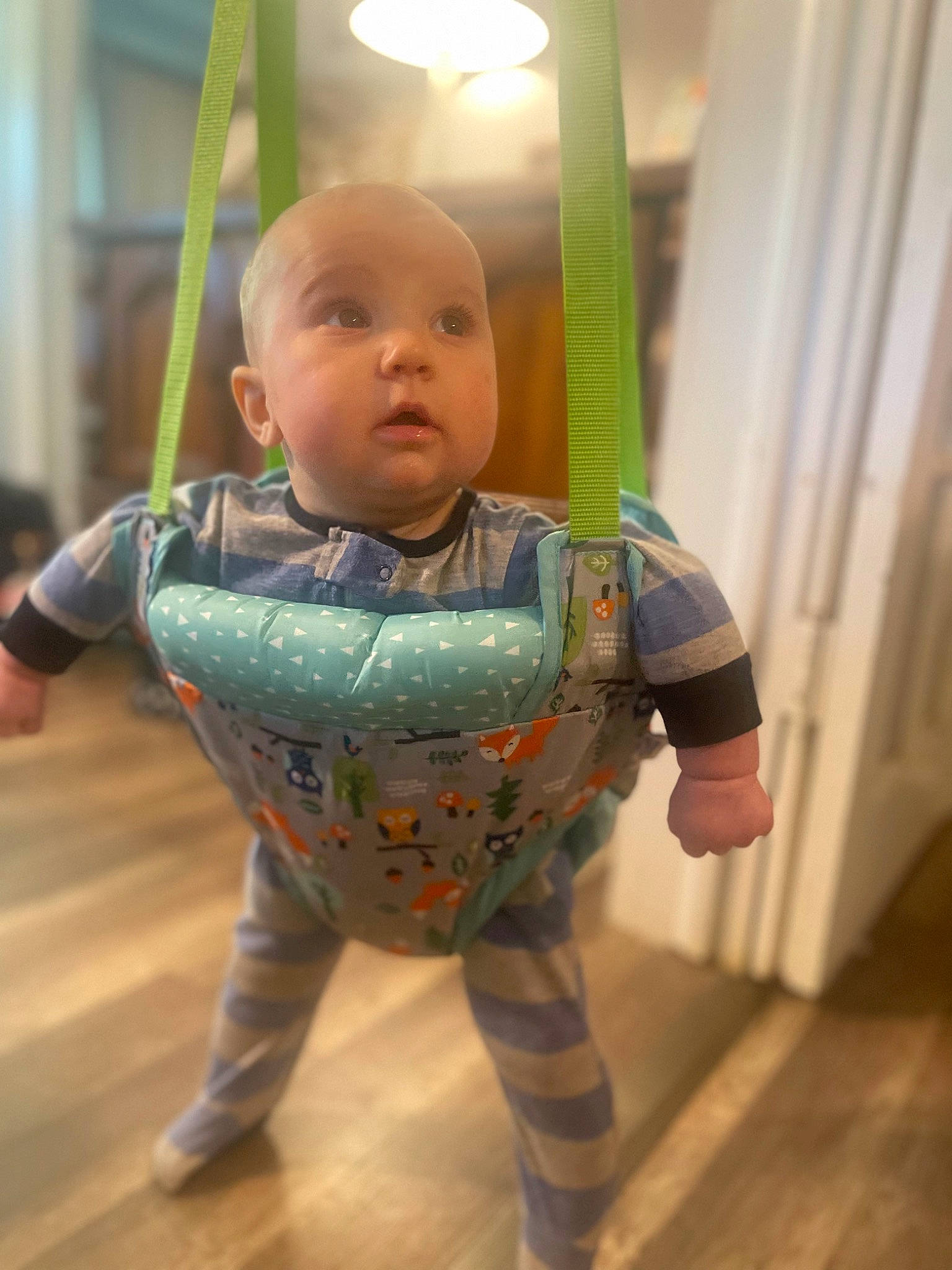 Finley is registered to the contest to win money with this photo: baby, baby_products, baby_toddler_clothing, cheek, child, eye, facial_expression, flooring, fun, happy, hardwood, pattern, person, play, room, sitting, skin, sleeve, t_shirt, toddler