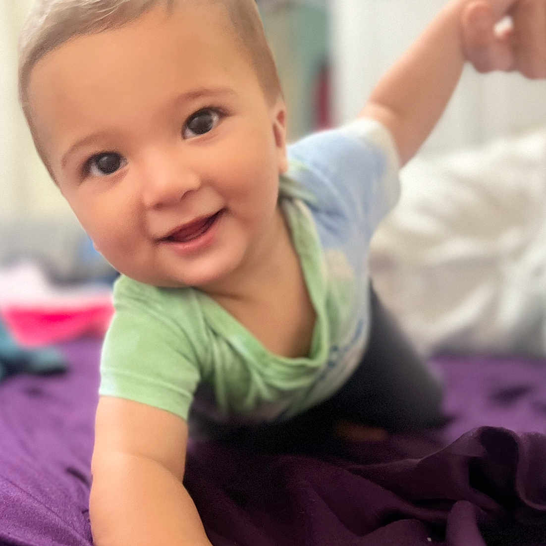 Brady is registered to the contest to win money with this photo: arm, baby, babycrawling, babylaughing, blonde, bodypart, crawling, face, finger, hair, hand, happy, head, person, photography, portrait, purple, smile