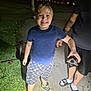 Malachi is registered to the contest to win money with this photo: child, boy, turtle, night, sidewalk, grass, person, tattoo, shorts, tshirt, smile, footwear, nike, slides, outdoor, nature, animal, holding, happy, park