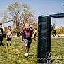 child, running, sports, outdoor, grass, tree, field, practice, team, coach, activity, sunny, people, athlete, training, exercise, hoodie, shorts, shoes, ladder