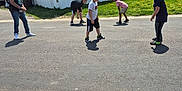 Malachi joined the competition — help win amazing prizes! child, adult, street, road, grass, mobile_home, house, sidewalk, sunny, daytime, people, casual_clothing, game, outdoor, shoes, tshirt, shorts, jeans, greenery, dandelions