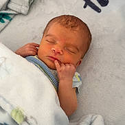 Rylan is registered to the contest to win money with this photo: newborn, baby, sleeping, blanket, soft, cute, infant, peaceful, cozy, hand, face, rest, bed, comfort, wrapped, child, indoors, closeup, adorable, young