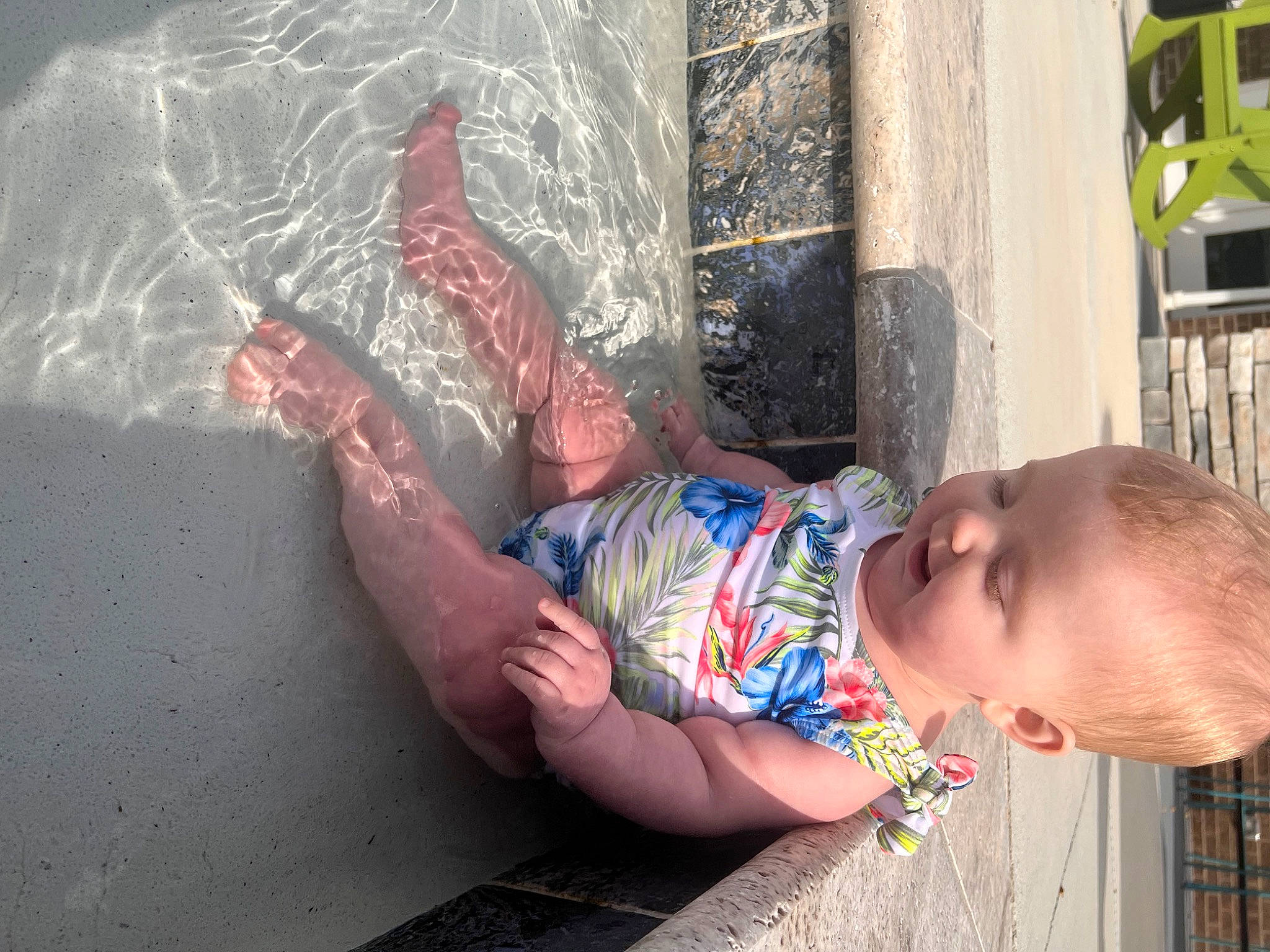 Freya is registered to the contest to win money with this photo: arm, baby, baby_toddler_clothing, barechested, bathing, child, elbow, flesh, foot, fun, happy, human_leg, leisure, mouth, person, sitting, thigh, toddler, tree, visual_arts