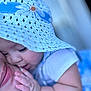 Ashley joined the competition — help win amazing prizes! baby, child, adult, face, close_up, hat, hand, affection, snuggle, skin, blue, white, clothing, glasses, love, tenderness, portrait, intimacy, soft_light, candid