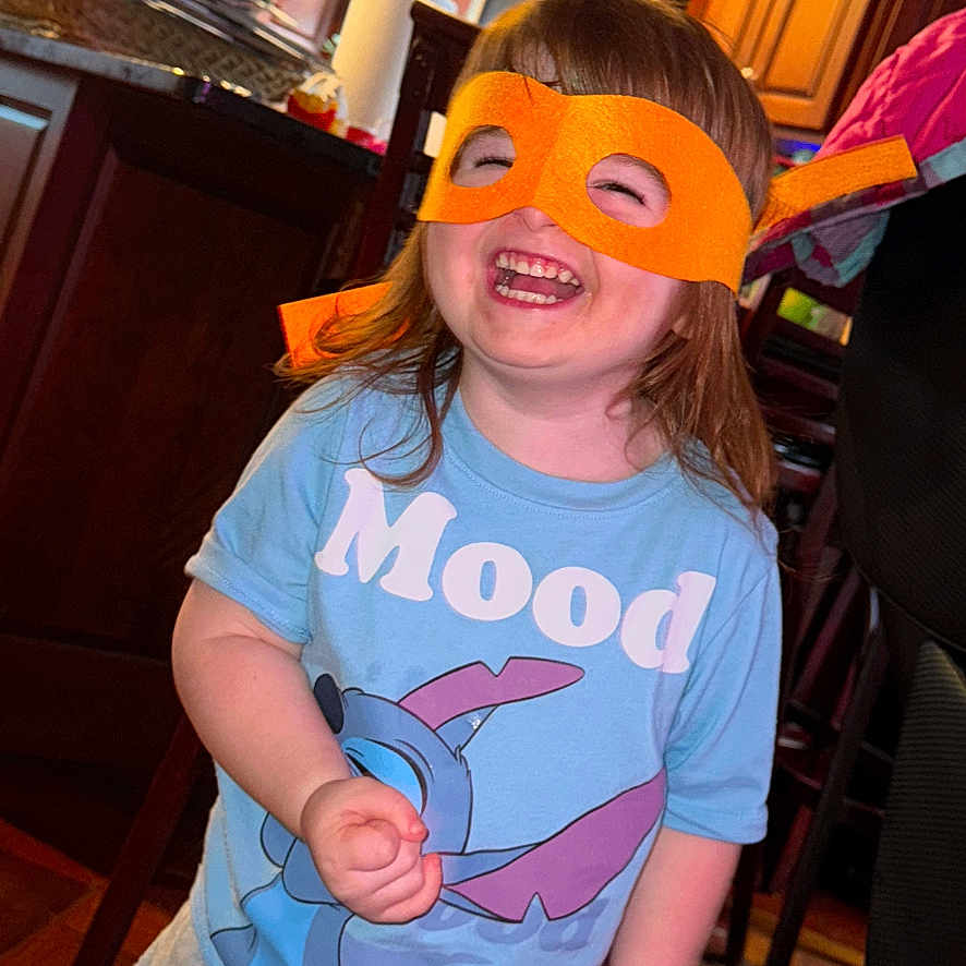 Harper joined the competition — help win amazing prizes! bodypart, child, clothing, couch, face, female, finger, furniture, girl, hand, happy, hardwood, head, pants, person, photography, portrait, smile, t_shirt, wood