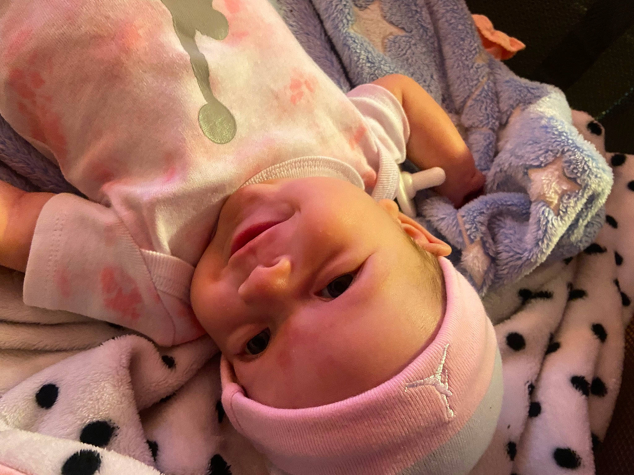 Khaleesi is registered to the contest to win money with this photo: baby, baby_products, baby_toddler_clothing, cheek, comfort, eye, eyebrow, eyelash, face, hand, head, headwear, human_body, linens, lip, mouth, nose, person, pink, skin