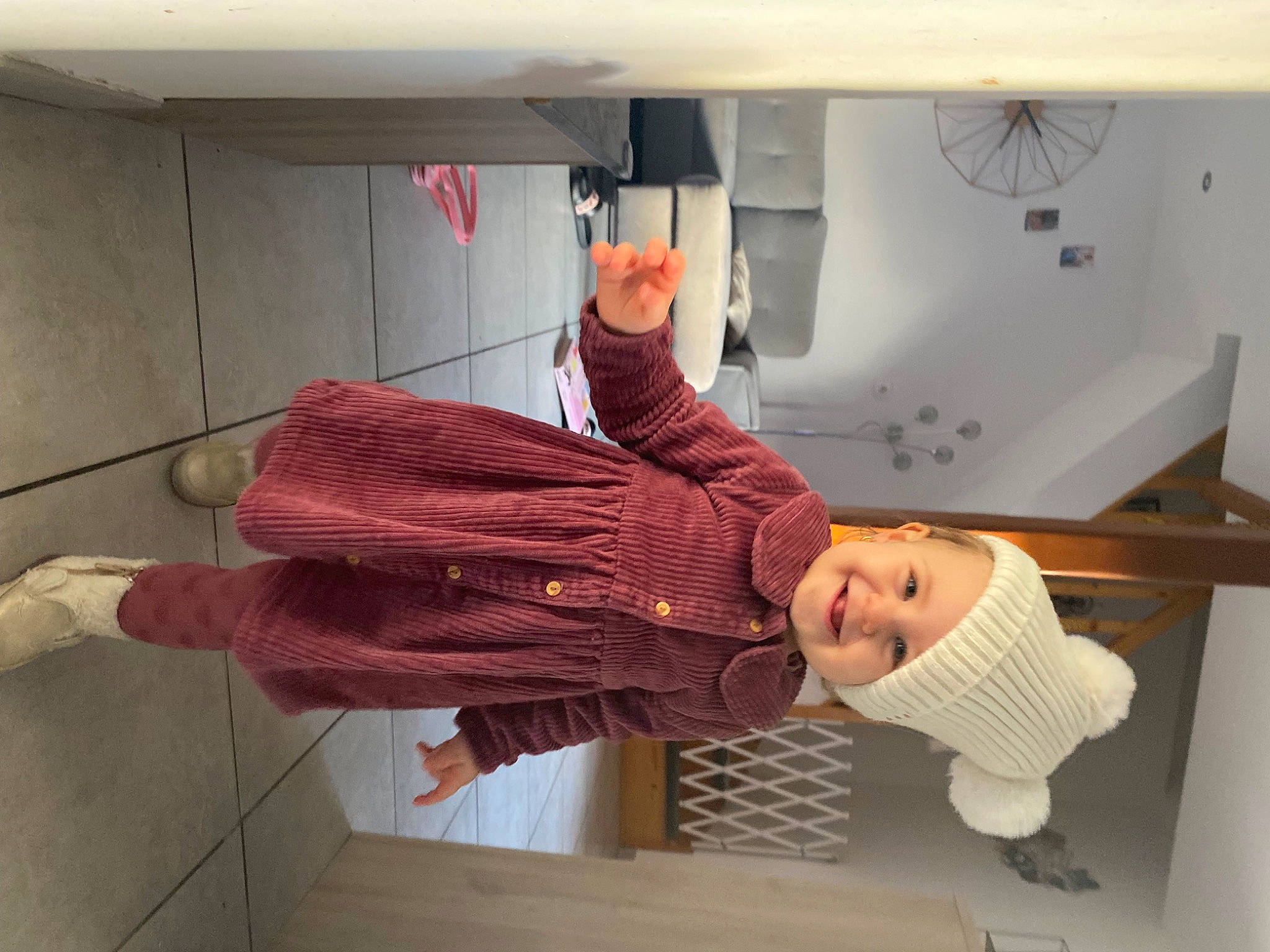 Ilona participe au concours pour gagner de l'argent avec cette photo : child, cleanliness, comfort, flooring, fun, hardwood, headwear, joy, knee, person, room, shelf, shelving, toddler, wood