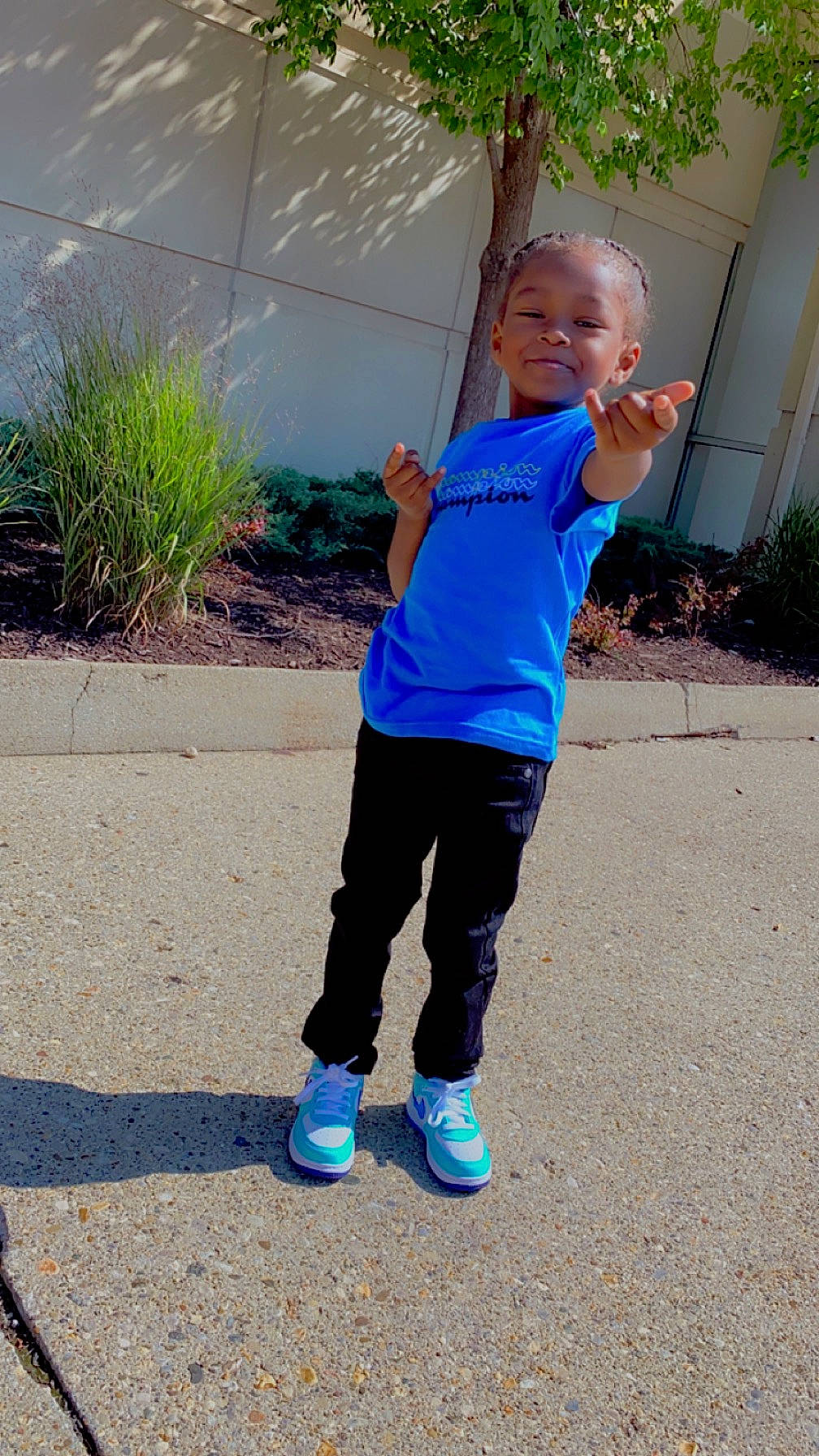 Bryson is registered to the contest to win money with this photo: asphalt, azure, cool, electric_blue, eye, face, grass, happy, head, joint, joy, leisure, people_in_nature, person, plant, public_space, shoulder, sleeve, smile, sportswear