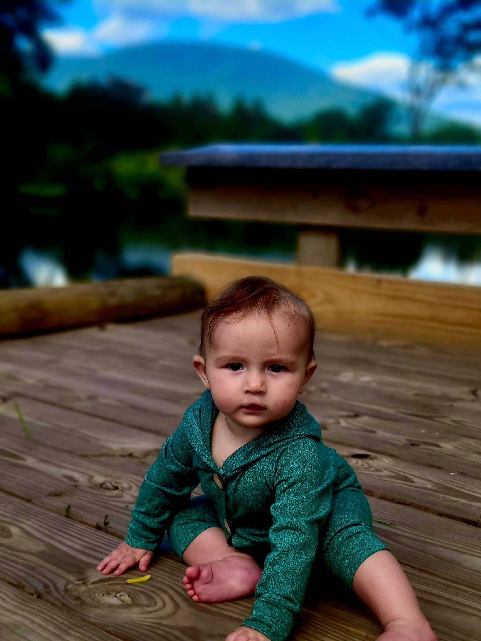 Bodhi is registered to the contest to win money with this photo: baby, baby_toddler_clothing, blue, child, floor, flooring, fun, grass, happy, hardwood, leisure, people_in_nature, person, sitting, skin, sky, summer, toddler, tree, vacation