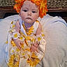 baby, child, flower_crown, sunflower_dress, blue_eyes, blanket, white_blanket, sitting, cute, adorable, indoor, portrait, infant, flower_garland, headwear, young_child, face, looking_up, woven_basket, soft_lighting